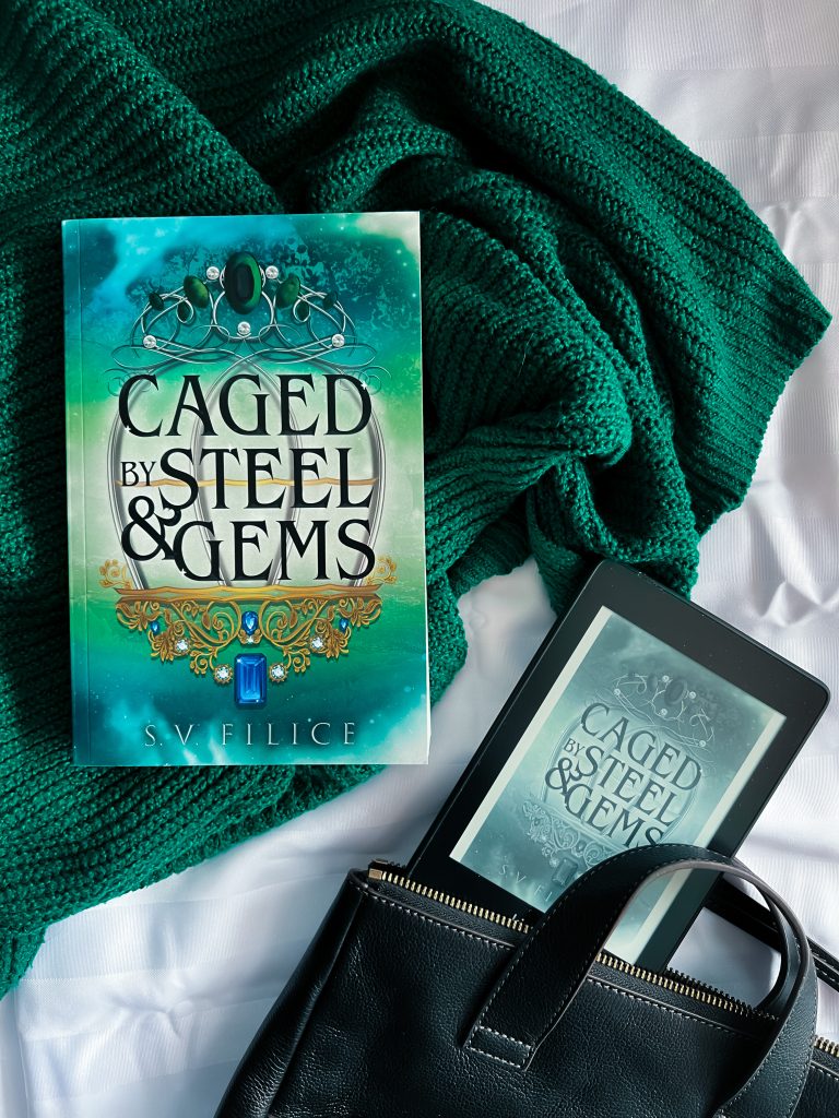 paperback laid out and kindle coming out of purse